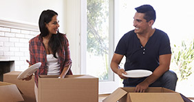 A couple packs up their belongings as they move to a new home.